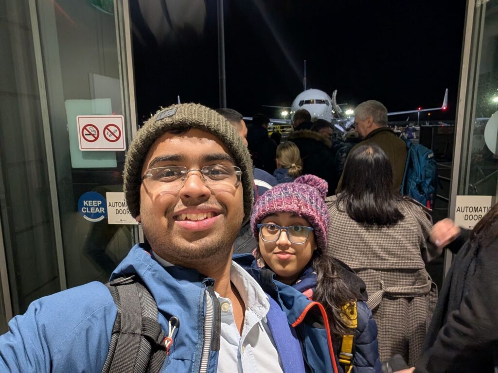 Tarun and Trisha standing in front of the aircraft