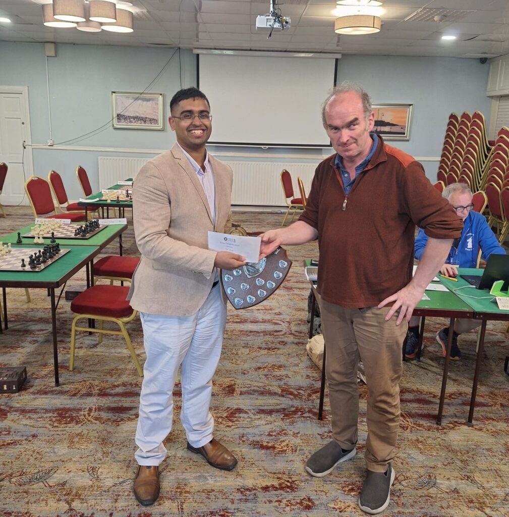 Tarun receiving 1st prize with Ennis Chess Congress 2025 Organiser John Cassidy